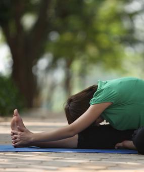 Yoga-Forward-bend-girl-touching-feet