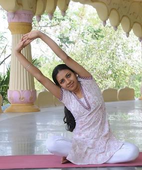 A Lady doing back stretching Exercise