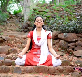 Meditation - Smiling Ekta meditating on the pathway in Ashram