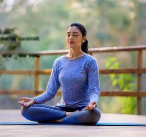 benefits of meditation - girl meditating at blr ashram