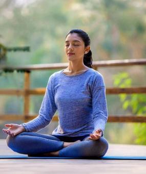 benefits of meditation - girl meditating at blr ashram