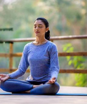 benefits of meditation - girl meditating at blr ashram