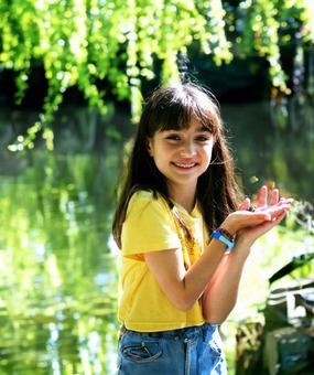 A happy child playing in the woods